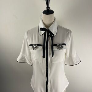 Chic White Blouse with Black Trim